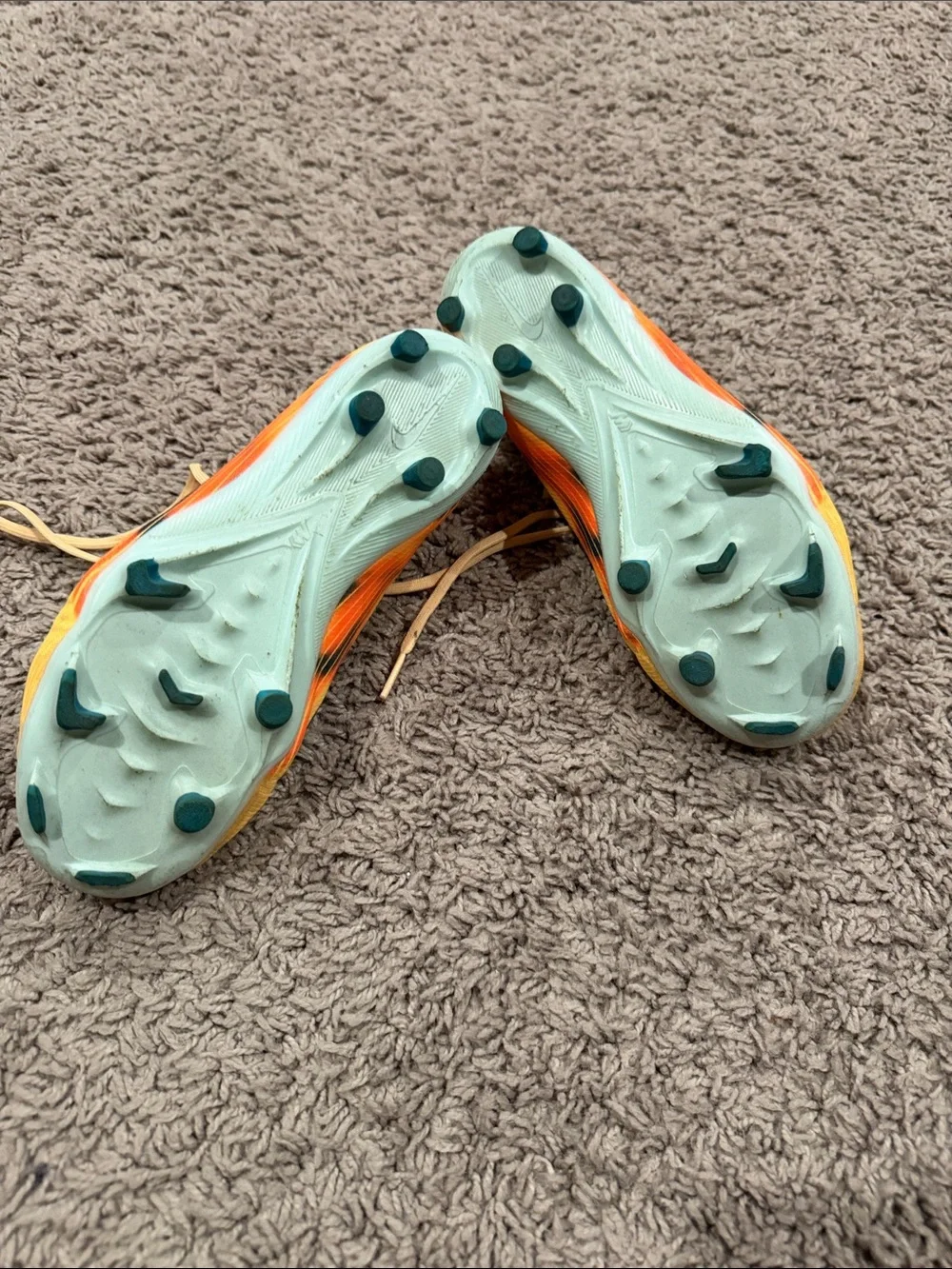 Nike Yellow Soccer Cleats with Blue Swoosh and Orange Accents